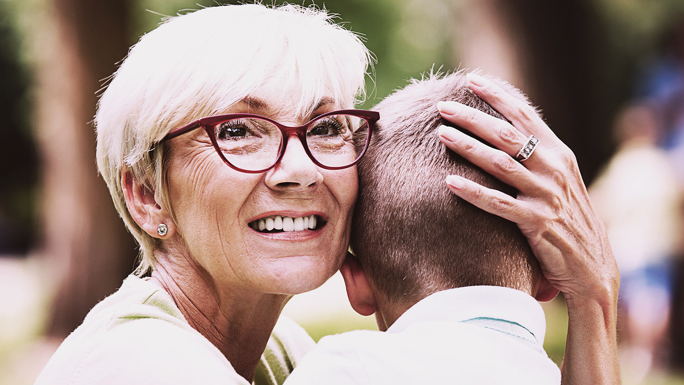 Hugging his grandma